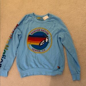 Aviator Nation Light Blue Crewneck Sweatshirt with Rainbow Logo